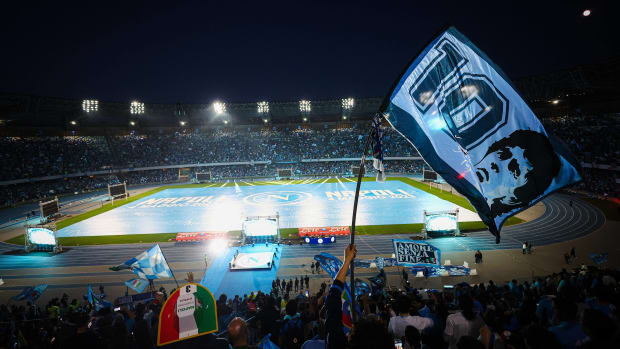Fans pictured at the Diego Armando Maradona Stadium watching on giant screens as Napoli's 1-1 draw at Udinese sealed the 2022/23 Serie A title